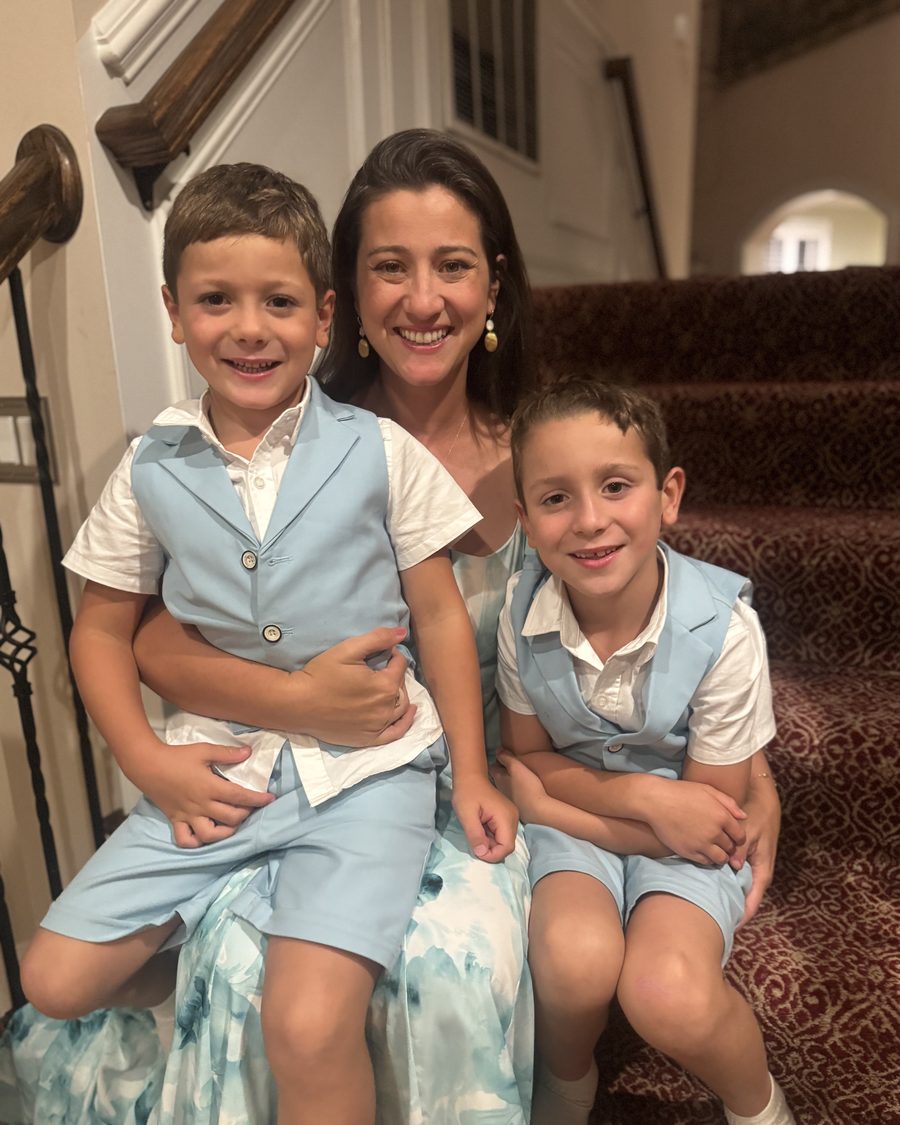 Jessica Lillard sitting on the stairs with their two sons
